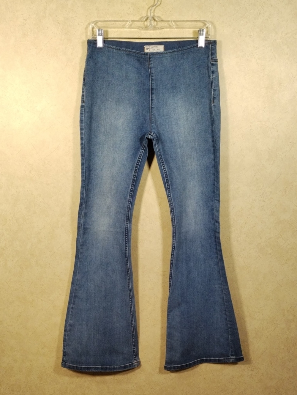 H167 Free People light wash stretch flat waist bell bottom jeans 30